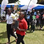 Ms. Susan Nzomo (Left) and Ms. Teresia Muia (Right) from Loyola -centre for media and communications (LCMC), lead young attendees in a tree planting session, echoing the call of UN SDG 13 on climate action. - LCMC | Media literacy education | Artificial Intelligence | Resilience | Formation | Media and communications training |Digital media literacy