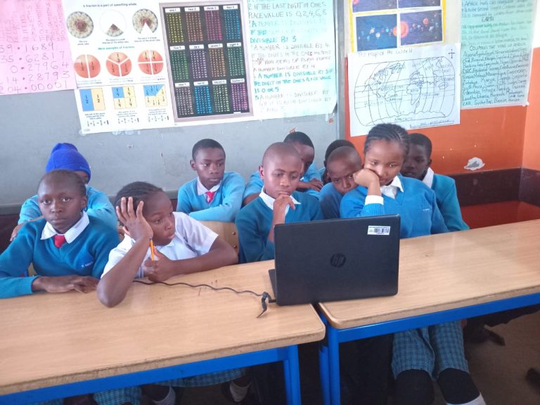 Learners in Mukuru Promotional Centre paying attention during the online conference.